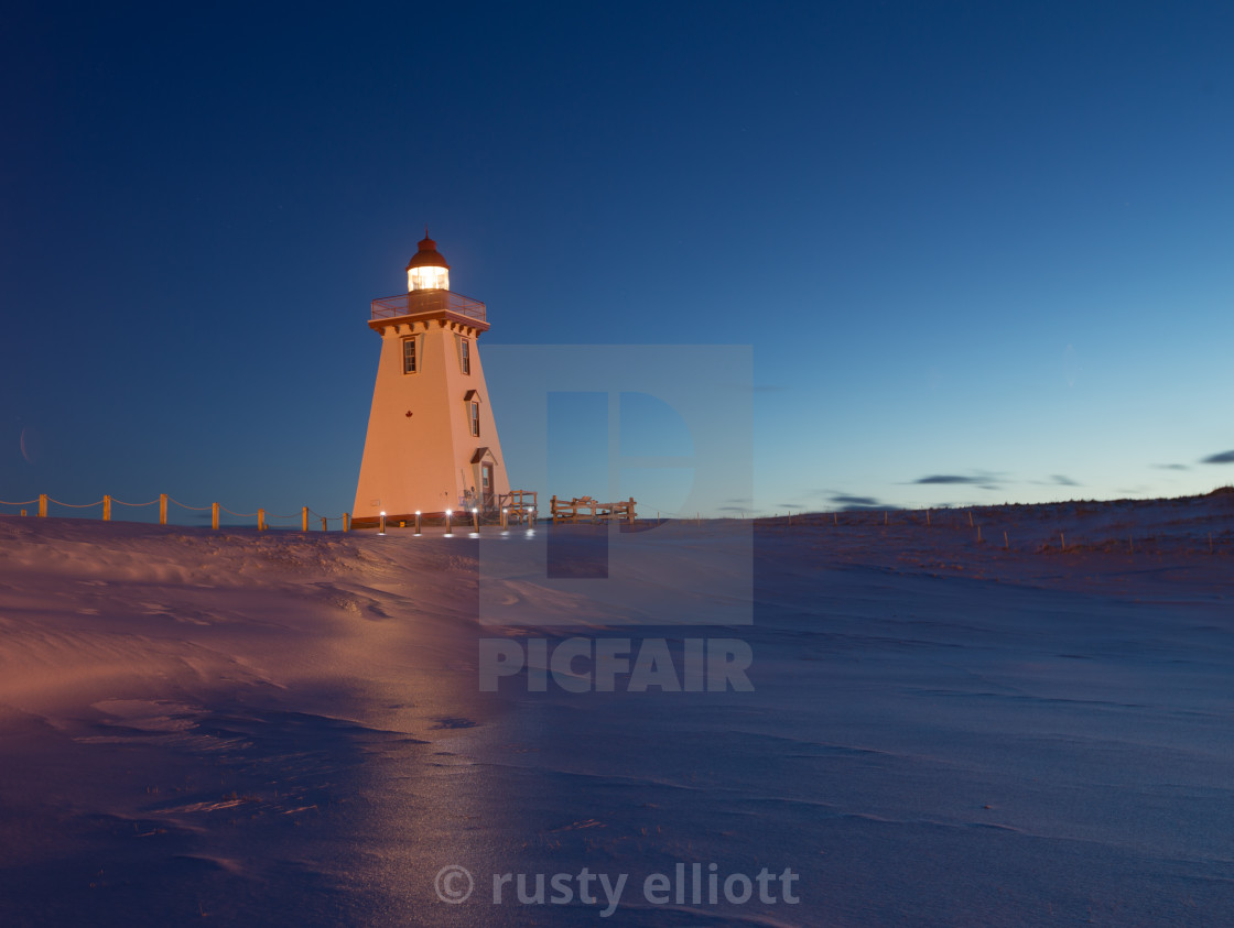 Lighthouse At Night In The Winter In Prince Edward Island