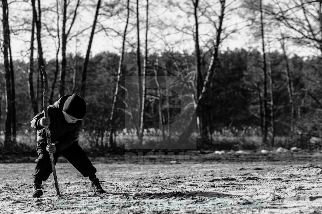 "The boy with a stick" stock image