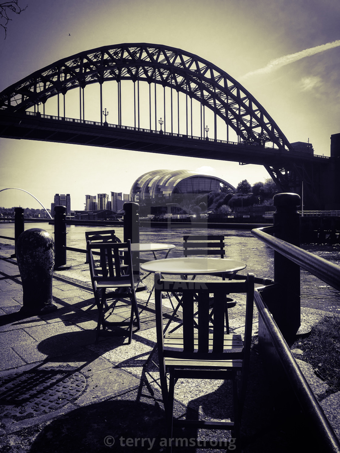 "tables on the quayside" stock image