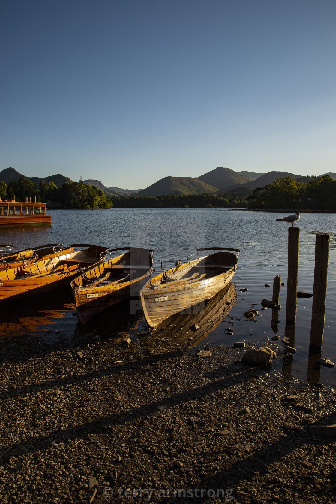 "derwent water rowing boats sunset" stock image