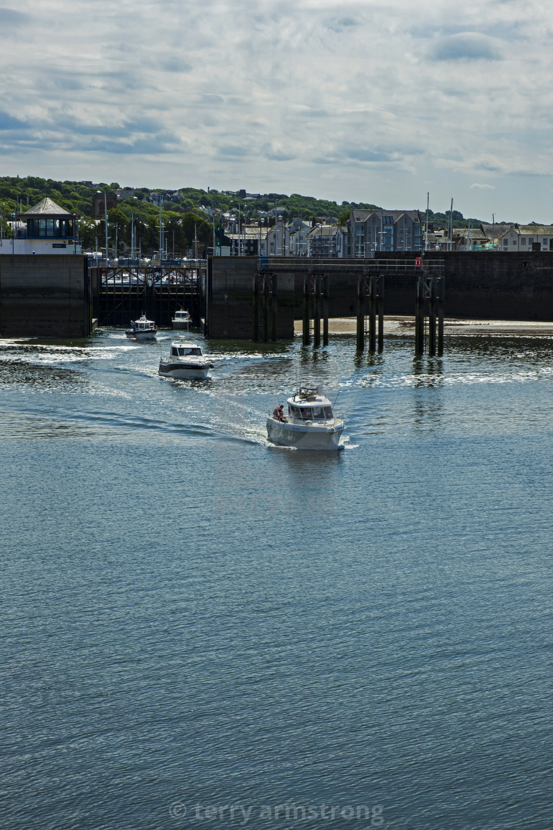 "boats leaving whitehaven harbour" stock image