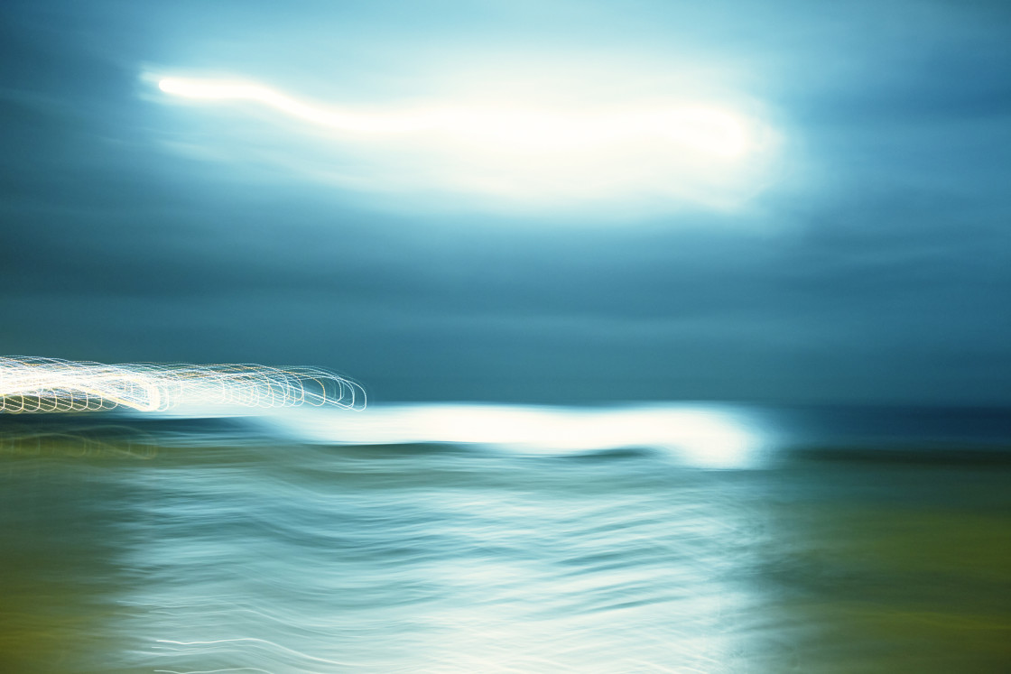 "Moonlight and patterned lights over seaside" stock image