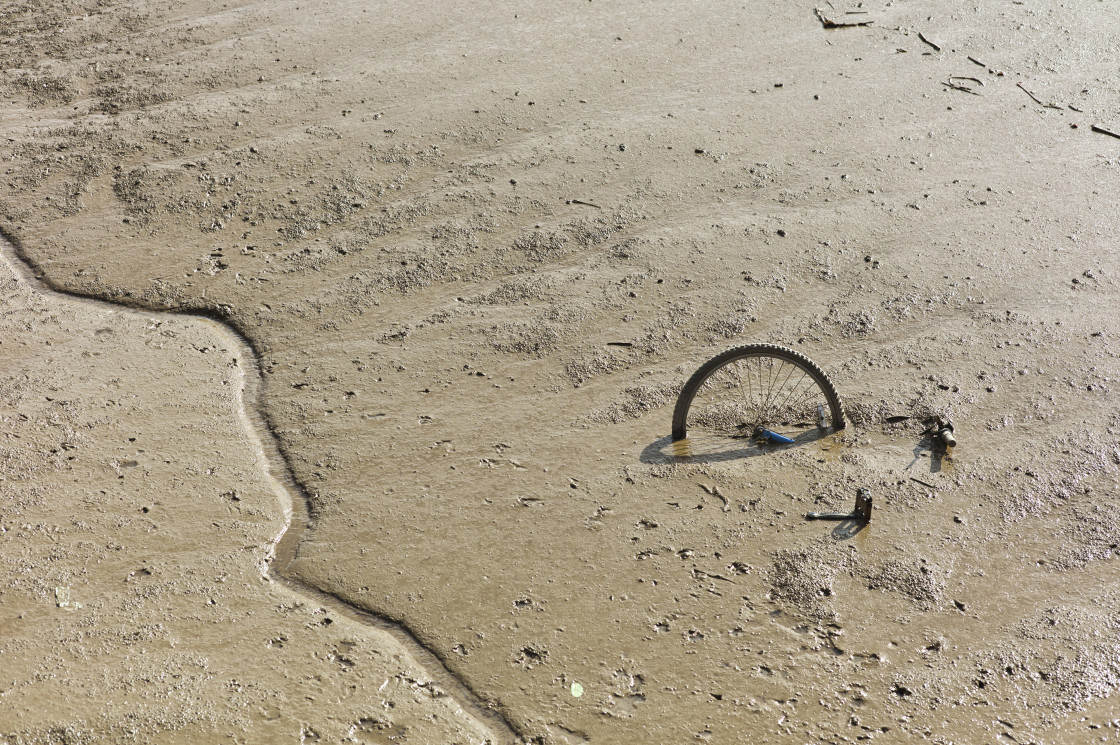 "Bicycle in mud of the river Hull" stock image