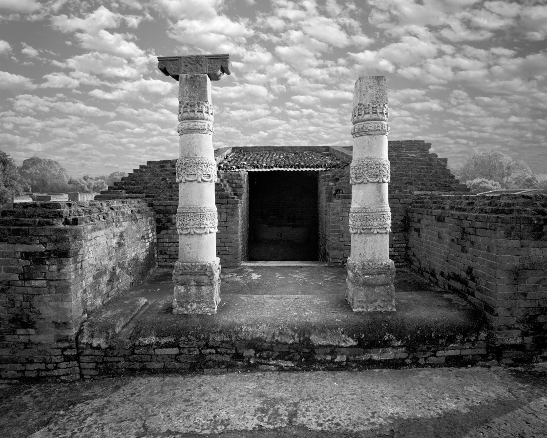 "Pillar and Temple entrance, Nalanda, India" stock image