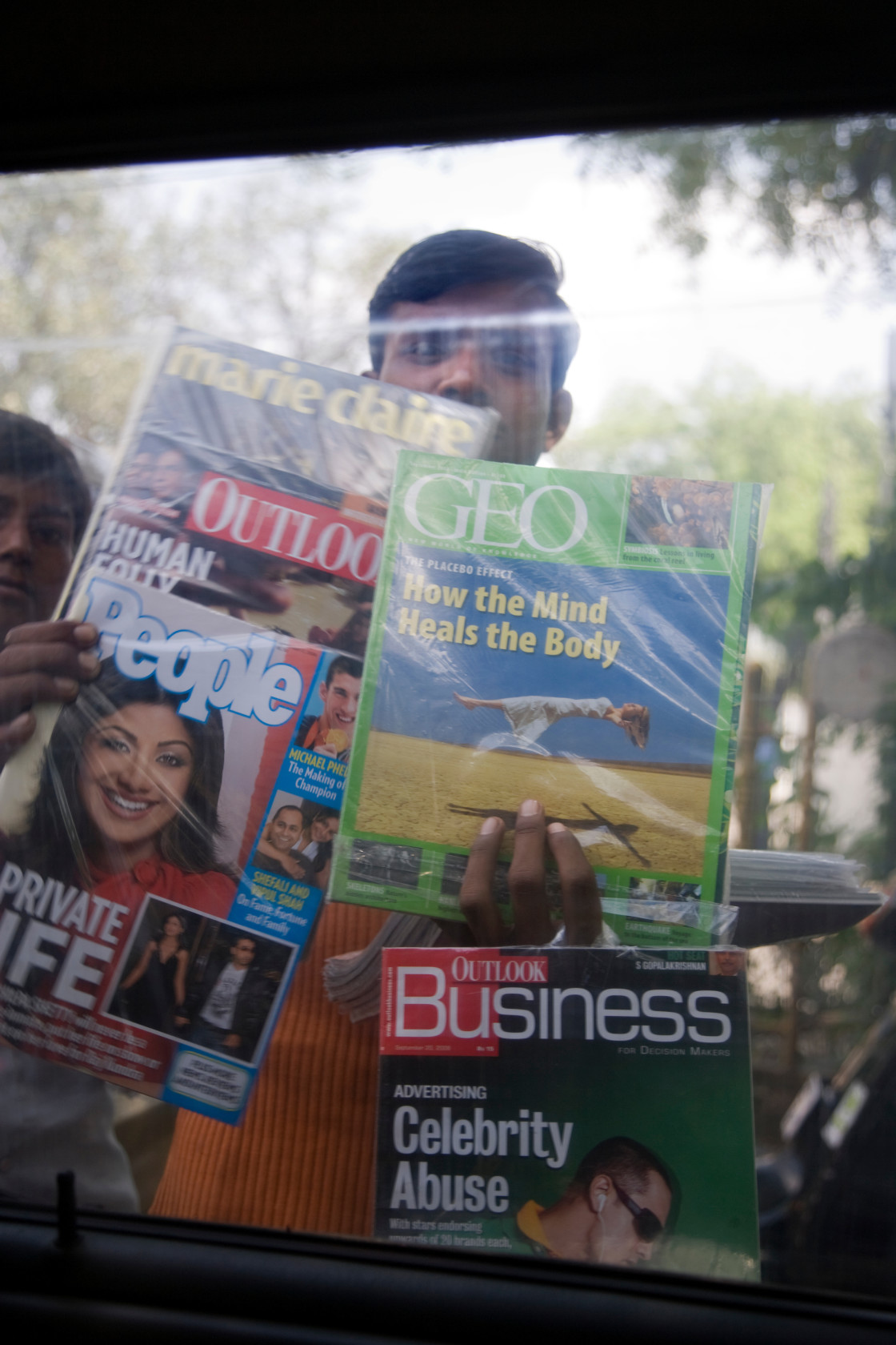 "Man selling magazines, New Delhi, India_G3T8082" stock image