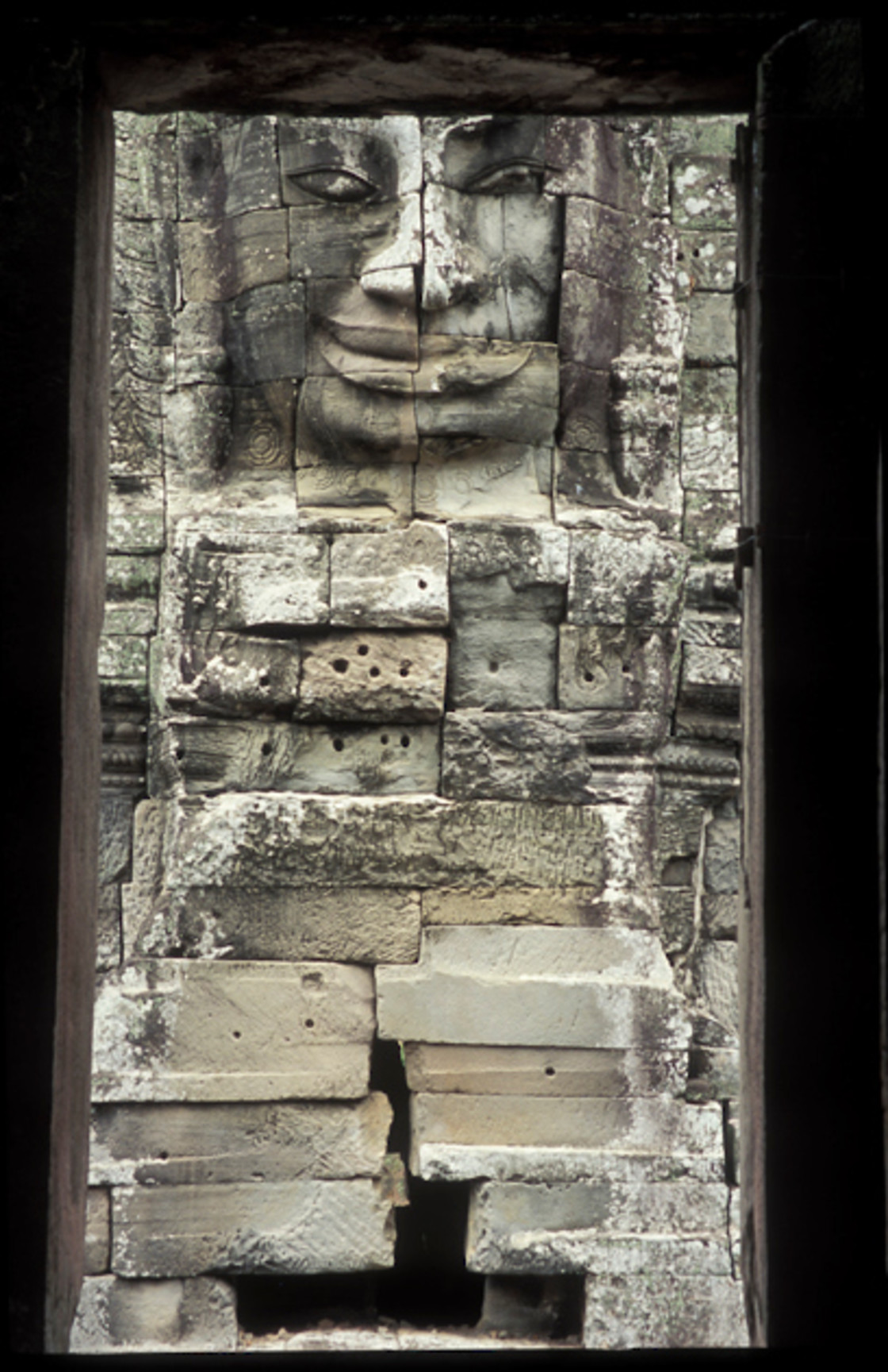 "Stone Buddha through doorway, Angkor Wat Temple, Cambodia" stock image