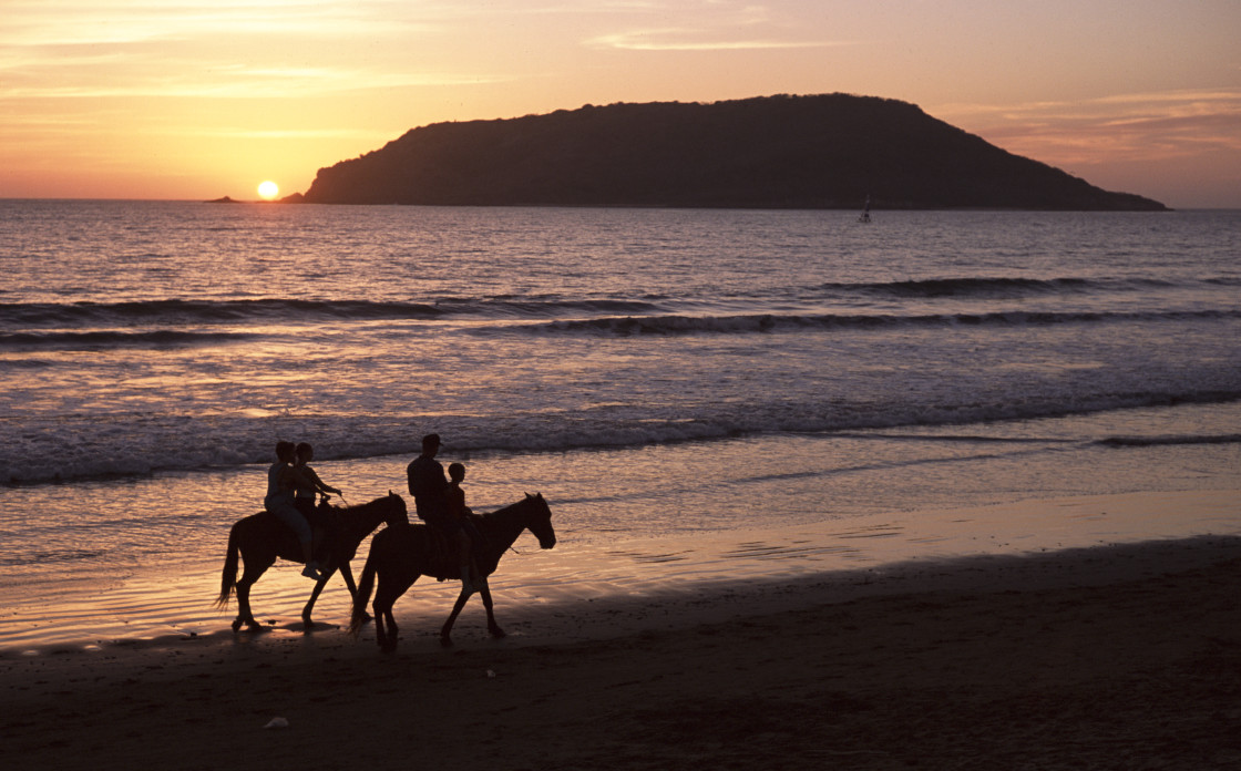 "Horseback riders on beach, Sayulita, Mexico" stock image