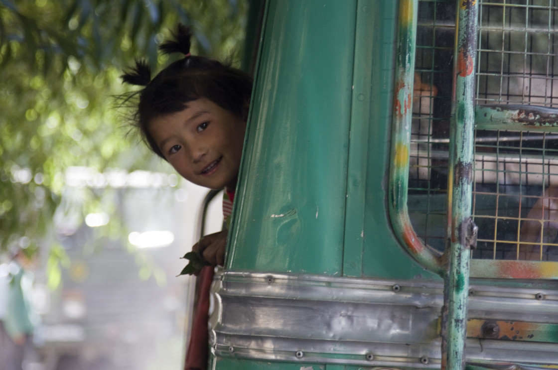 "Boy looking out bus window, Ladakh, India" stock image