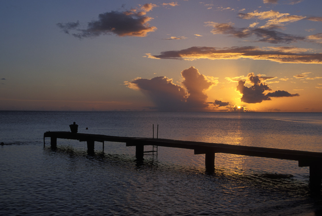 "Sitting on dock watching sunset, Dominica" stock image