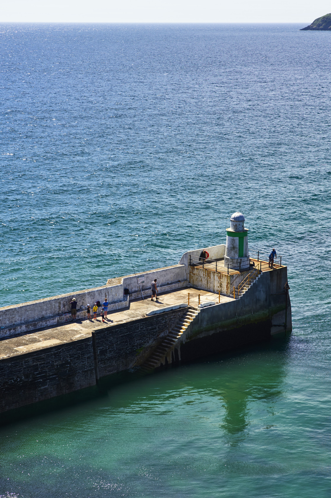 "People fishing at Laxey, Isle of Man" stock image