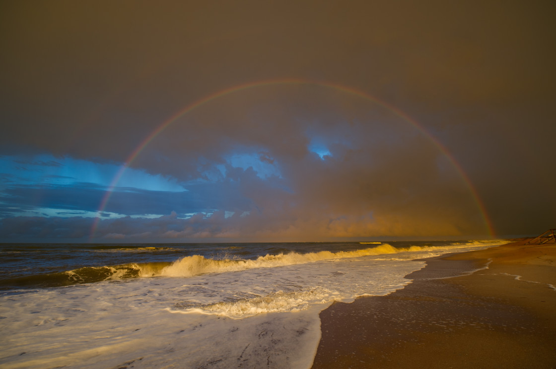 "Rainbow at the beach" stock image