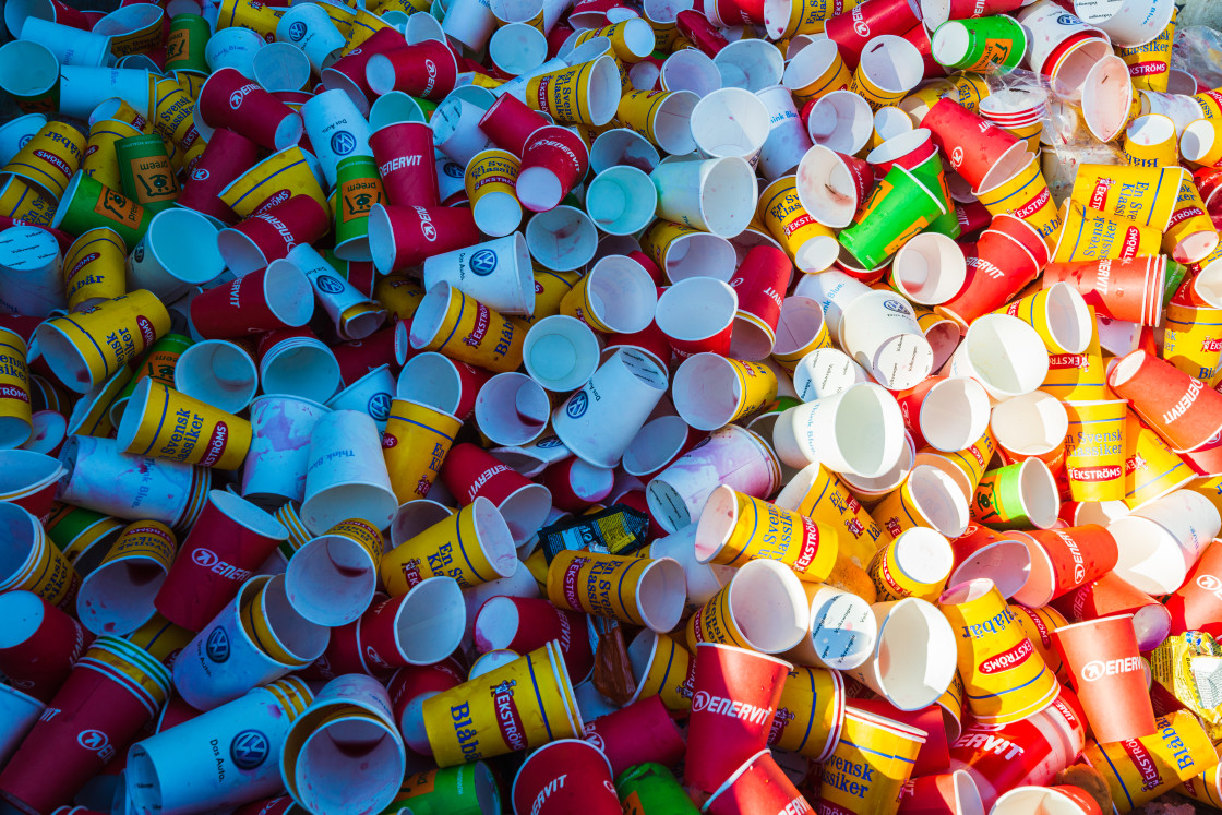 "Used multi coloured disposable cup" stock image