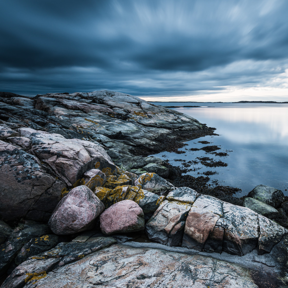 "Rocky coastline with dramatic sky" stock image