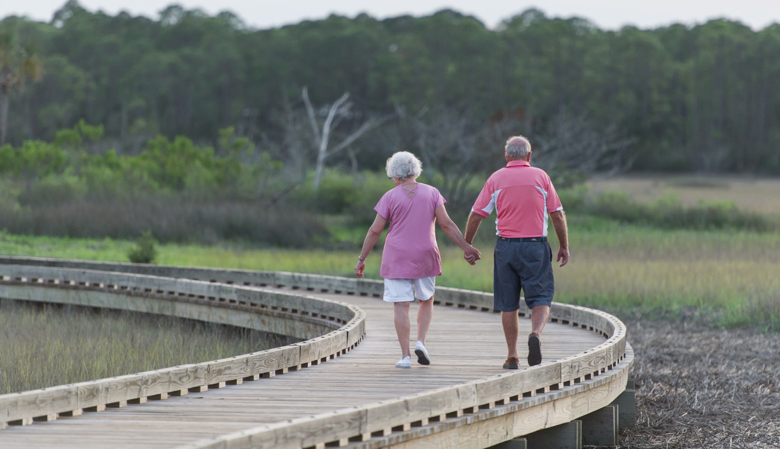 "Senior Couple walking in step" stock image