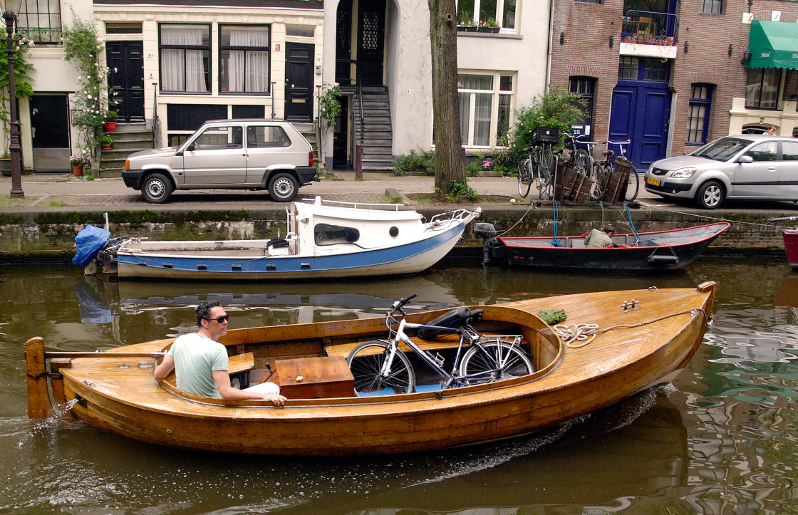 "Boater in the Amsterdam canal" stock image