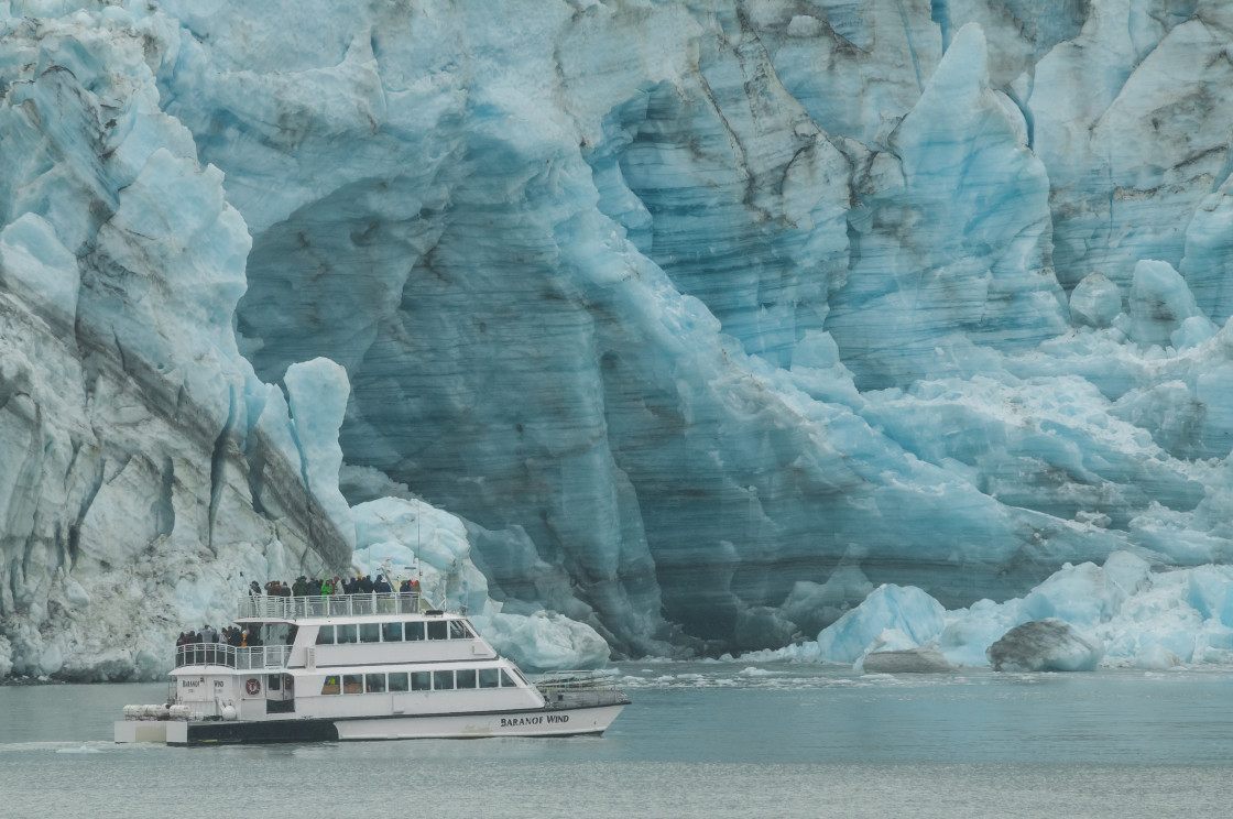 "Alaska tour boat by a glacier" stock image