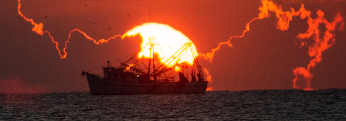 "Shrimp boat at sunrise" stock image