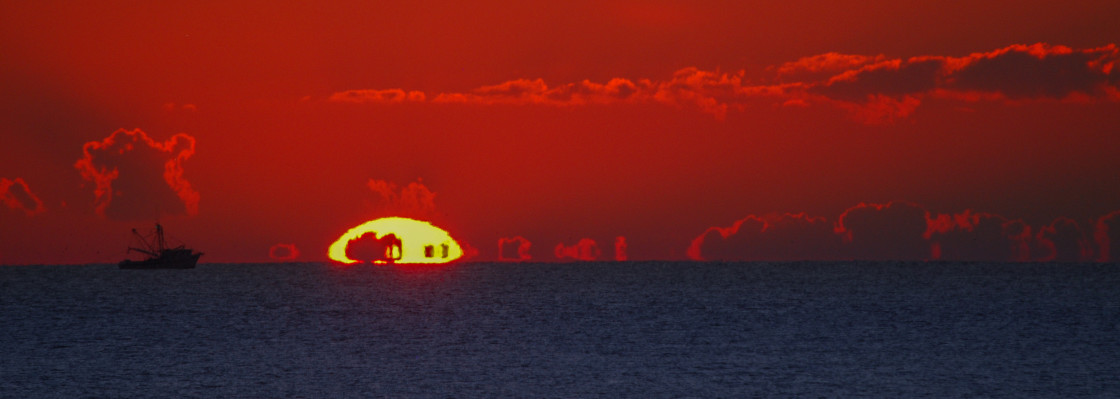 "Shrimp boat at sunrise" stock image