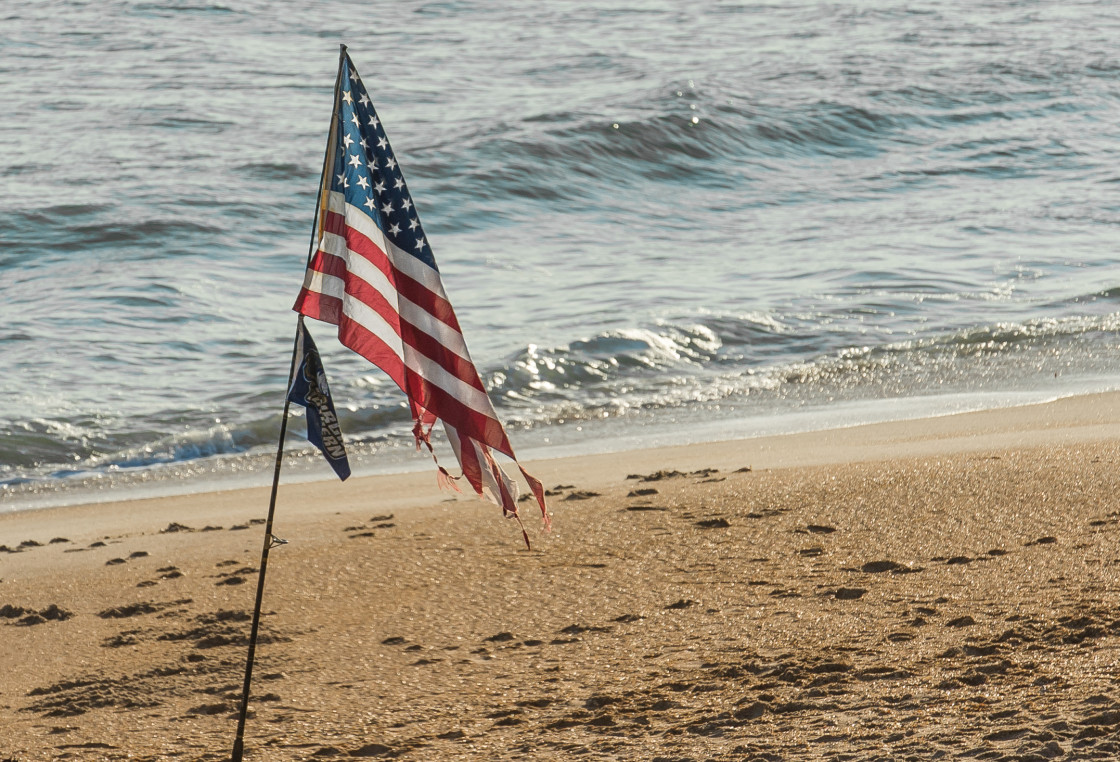 "The American flag on the beach" stock image