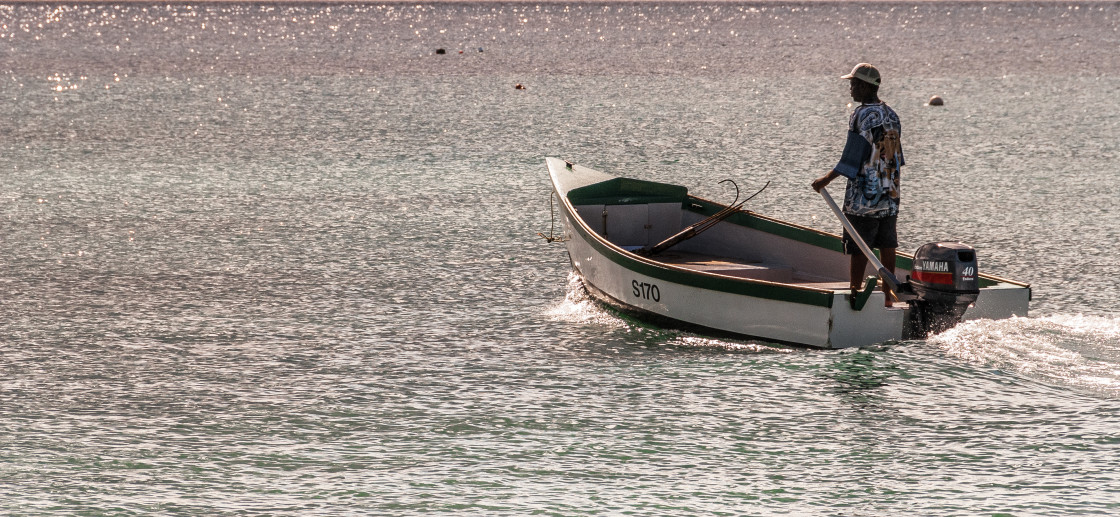 "Man in a pleasure boat on the ocean" stock image