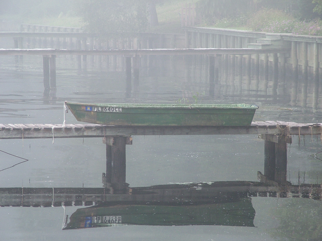 "Boat laying on a dock in the fog" stock image