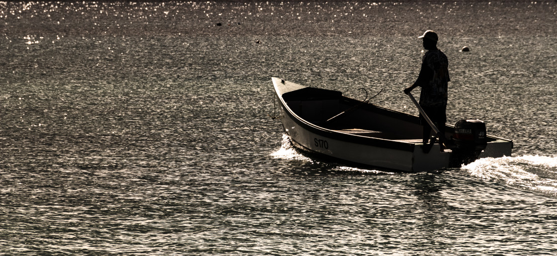 "Man in a pleasure boat on the ocean" stock image