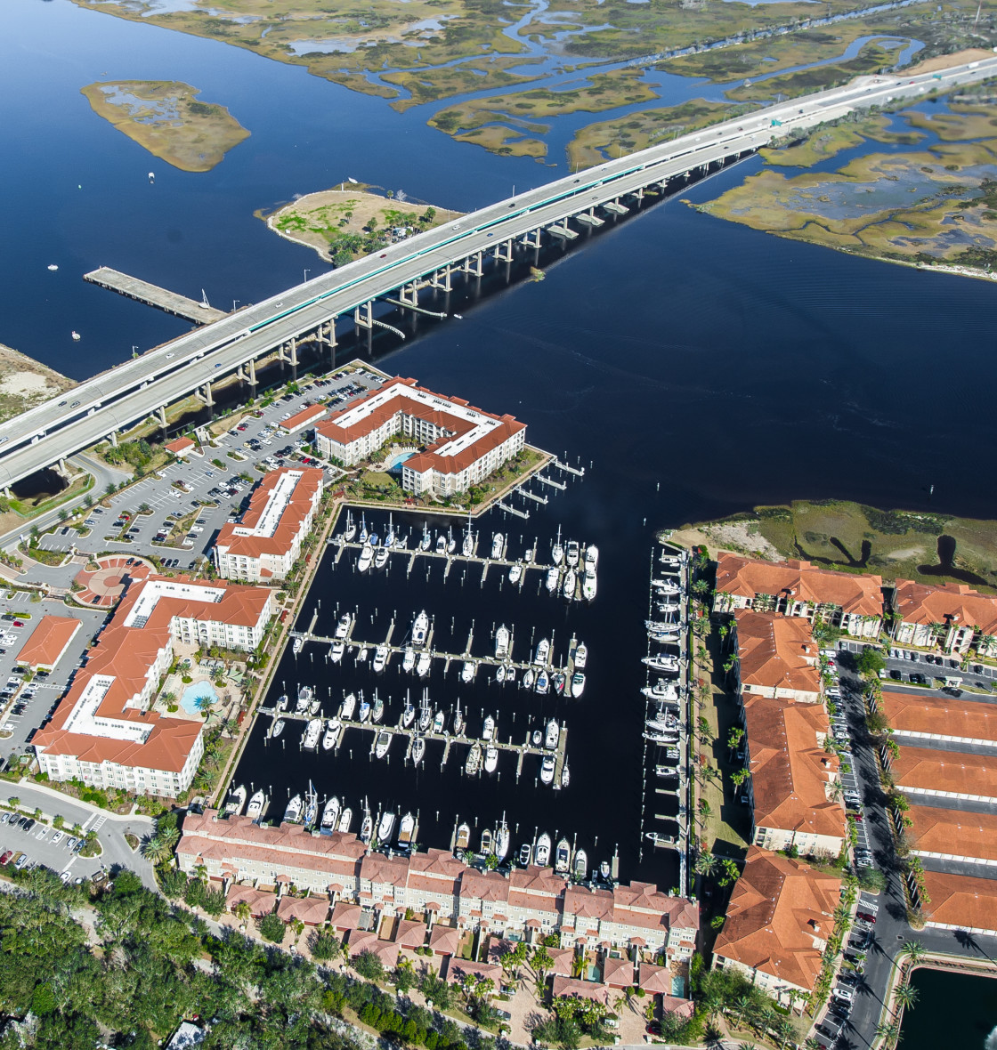 "Marina, condominiums and boats aerial" stock image