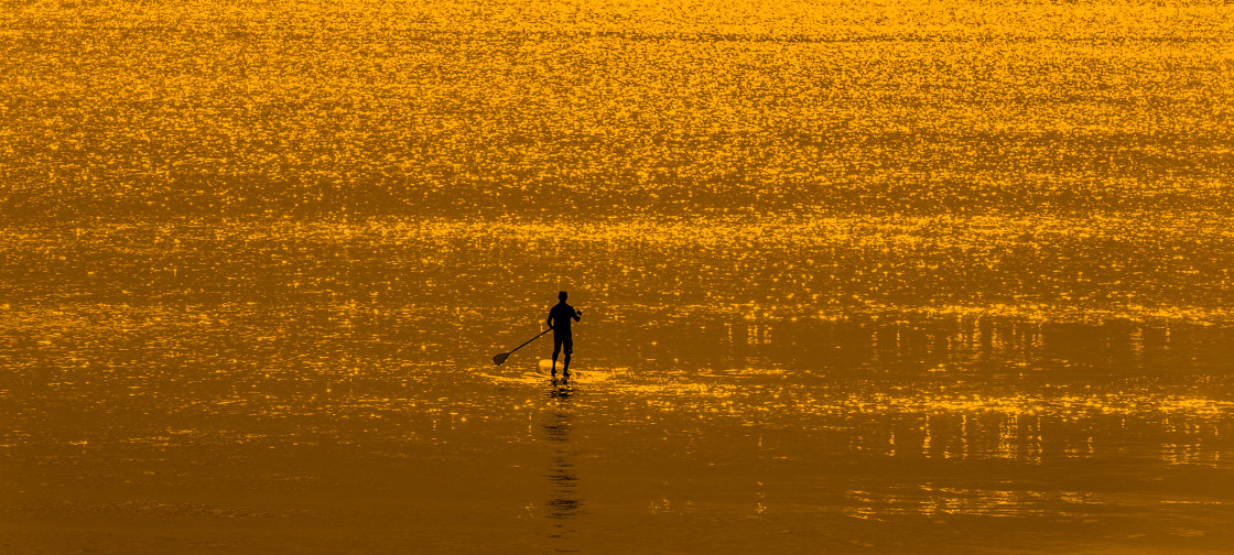 "Stand up paddle board at sunrise" stock image