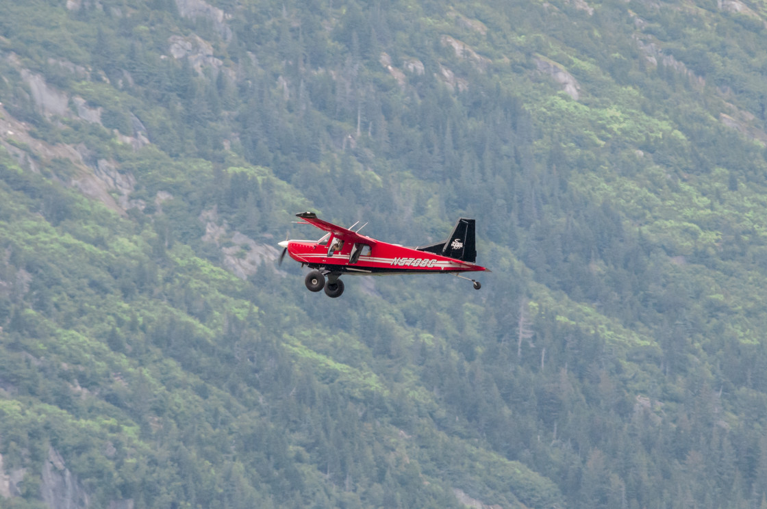 "Alaskan bush plane in flight" stock image