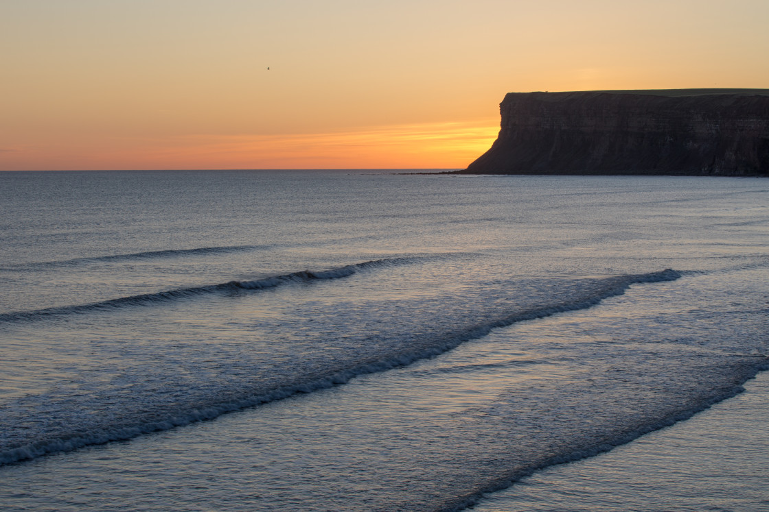 "Saltburn cliffs and waves" stock image