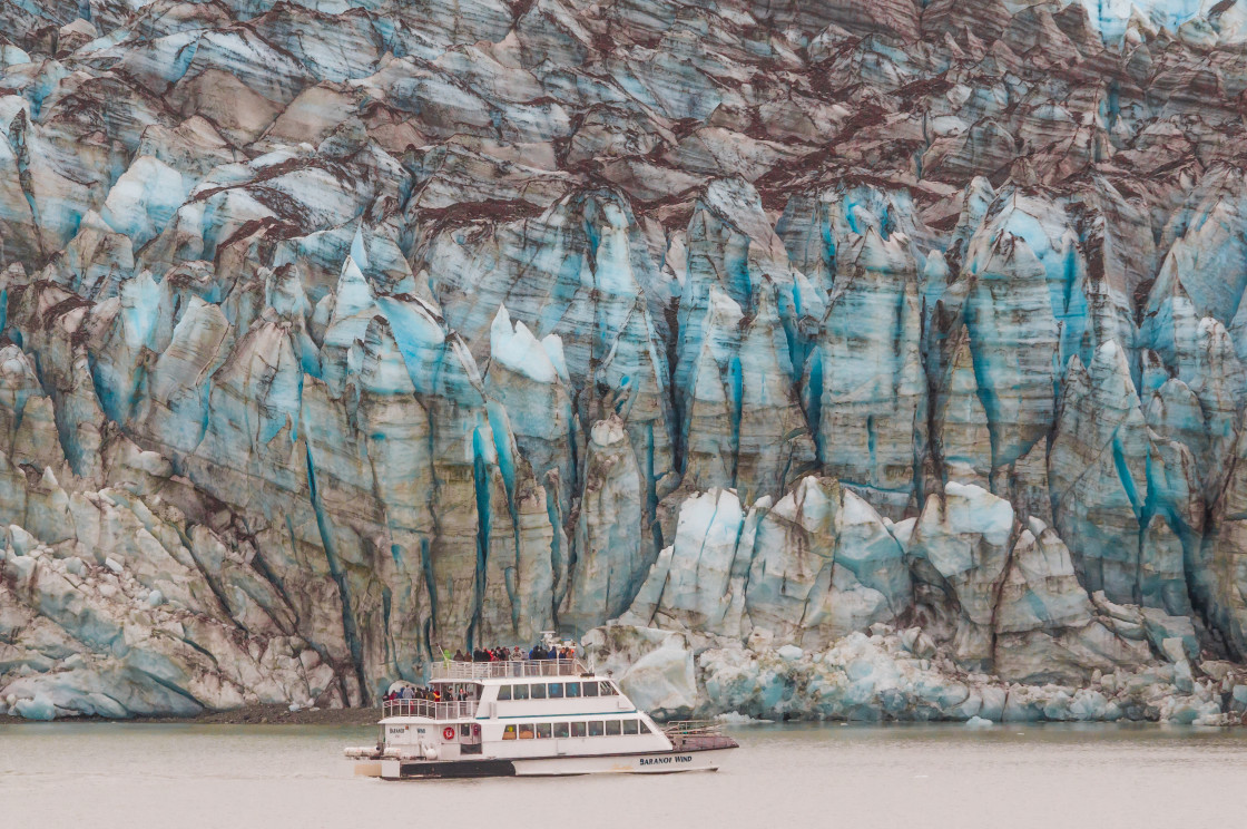 "Alaska tour boat by a glacier" stock image