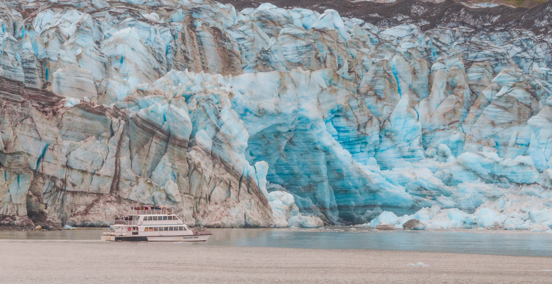 "Alaska tour boat by a glacier" stock image