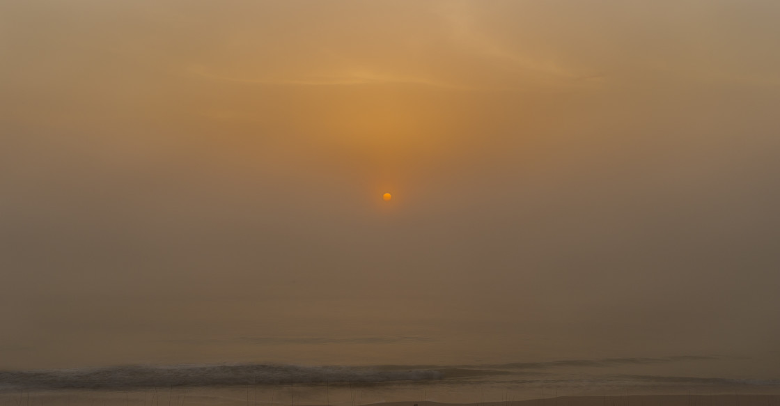 "Sahara dust tinged sunrise" stock image