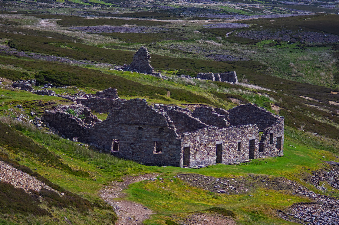 "An old industrial ruin leftover from ore mining and processing over 100 years ago, near the bridge over Barney Beck, Yorkshire Dales National Park, OS988998." stock image