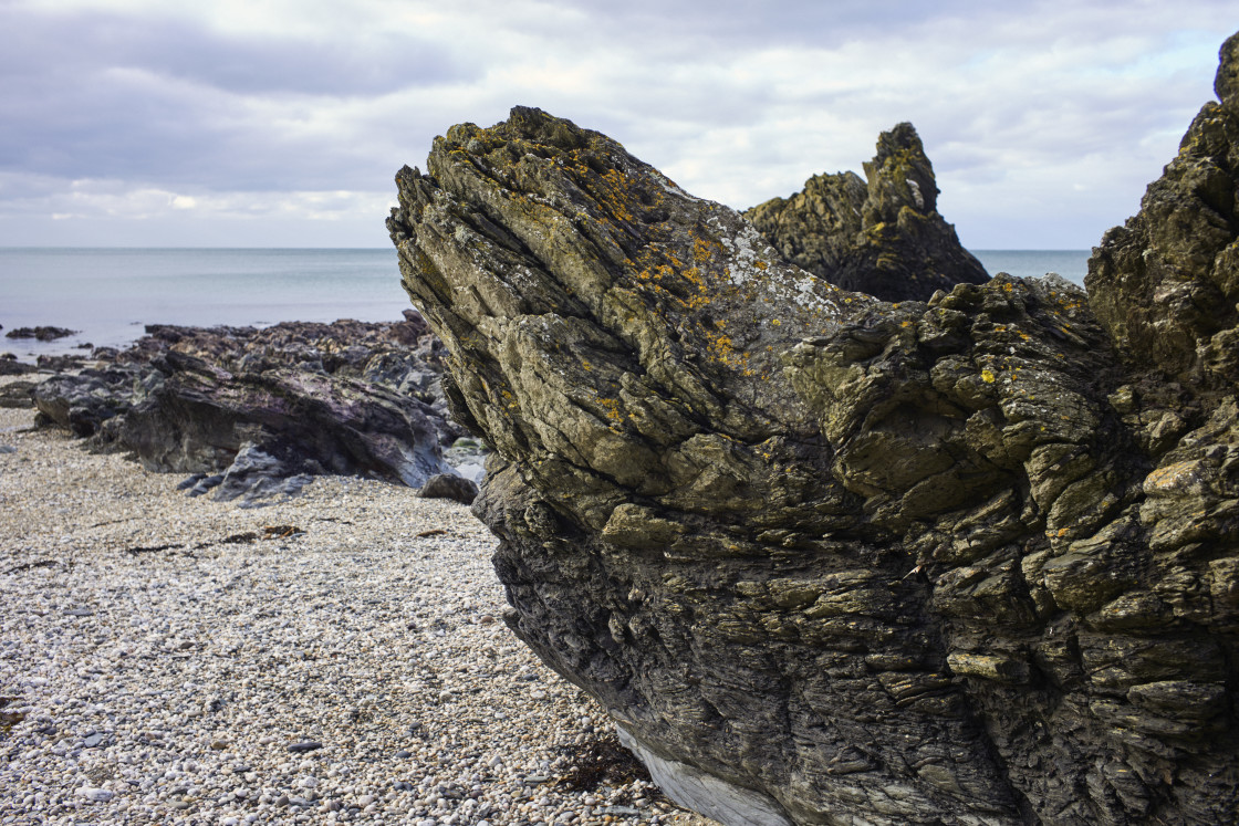 "Jagged rocks on the beach" stock image