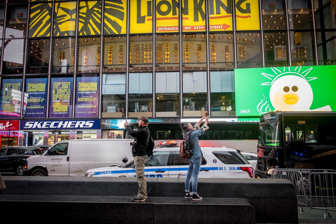 "Tourists taking photos, Times Square, New York." stock image