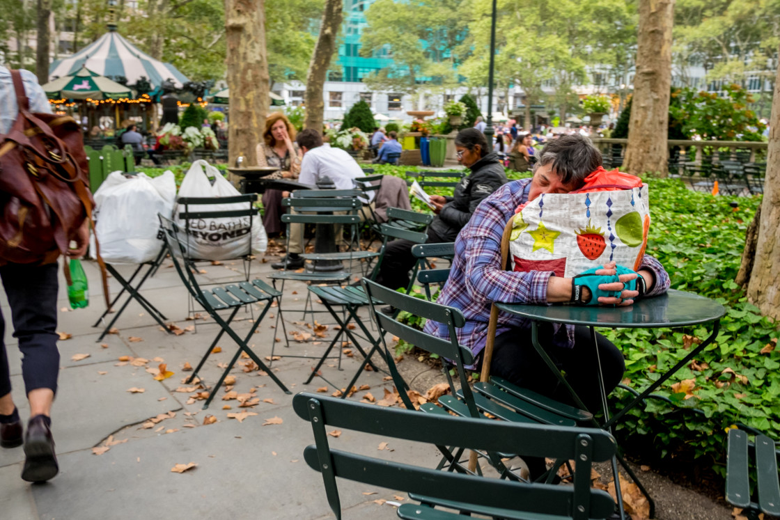 "Women sleeping in Bryant Park Manhattan." stock image