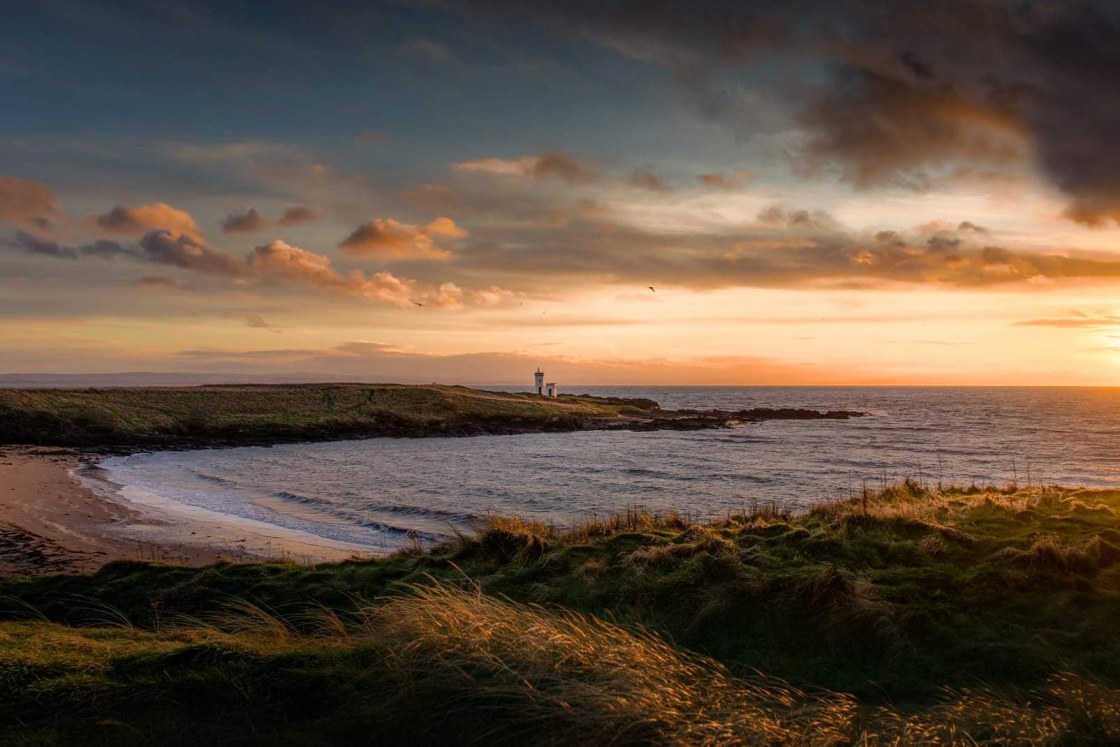 ""Lighthouse by the sea"" stock image