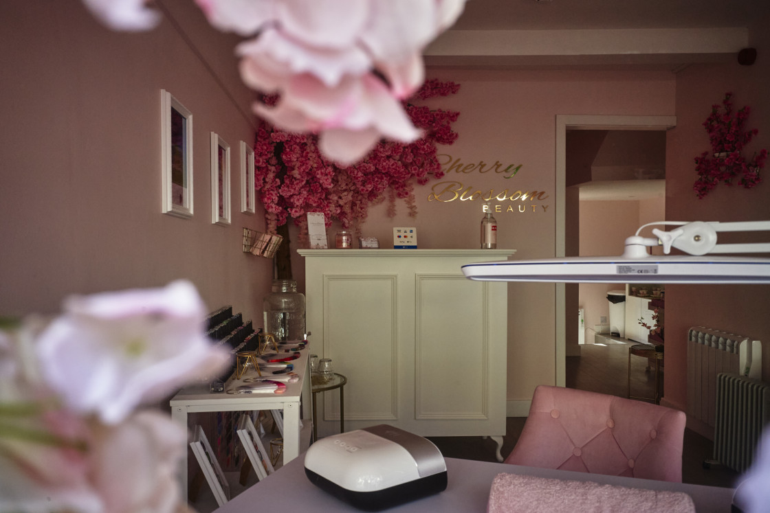 "Looking in the window of a Covid shut beauty salon in Douglas, Isle of Man" stock image