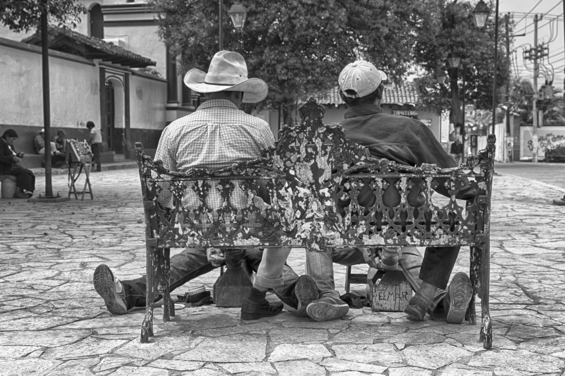 "Two men sitting on a bench, Valled de Bravo, Mexico." stock image