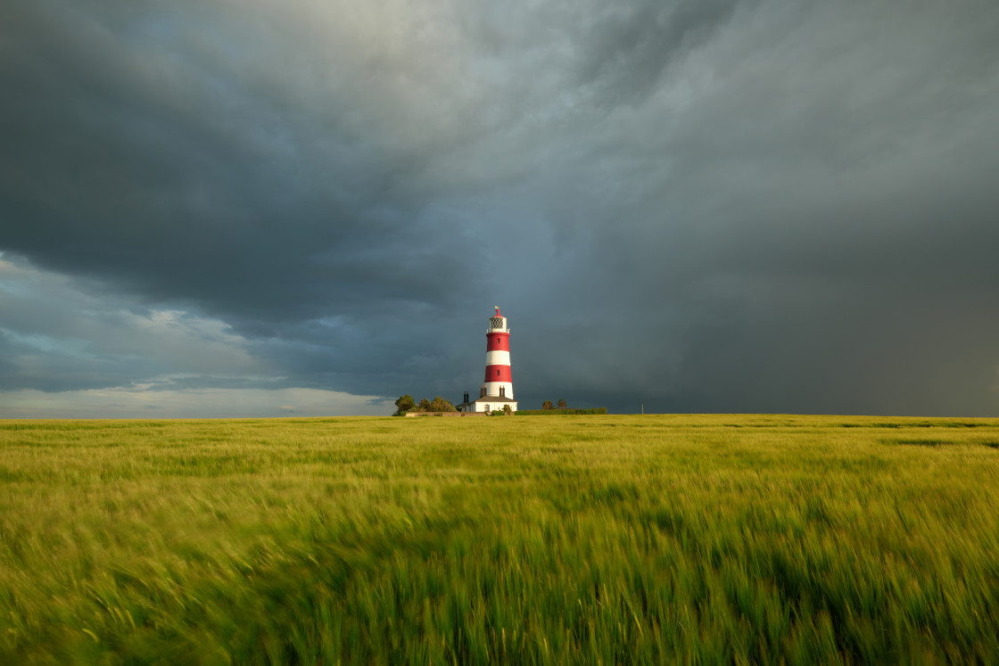 "Summer showers over Happisburgh Lighthouse" stock image