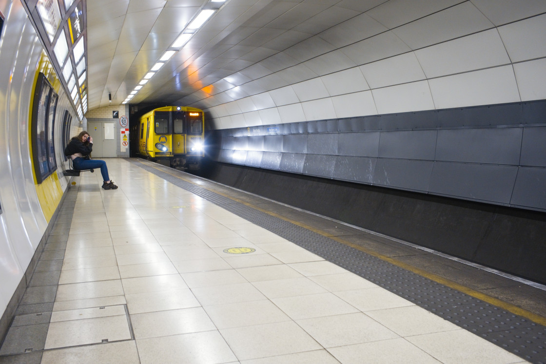 "Alone waiting for an underground train" stock image