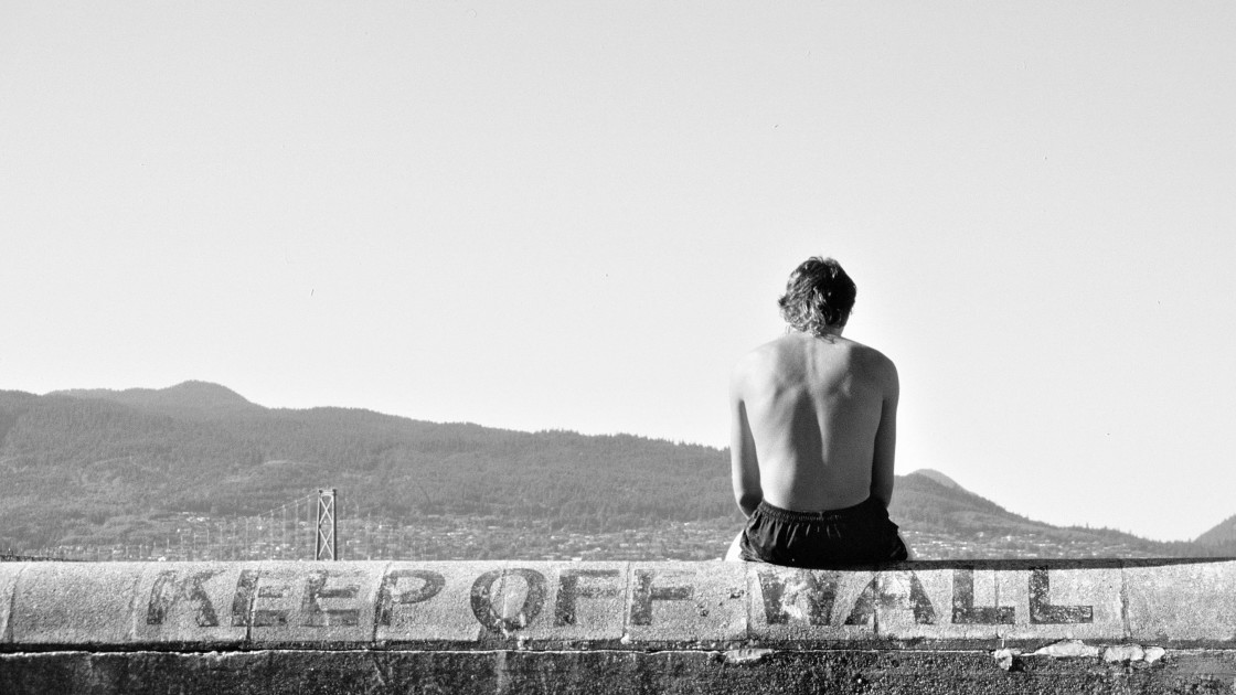 "Man sitting on Sea Wall, Vancouver, BC, 1984" stock image