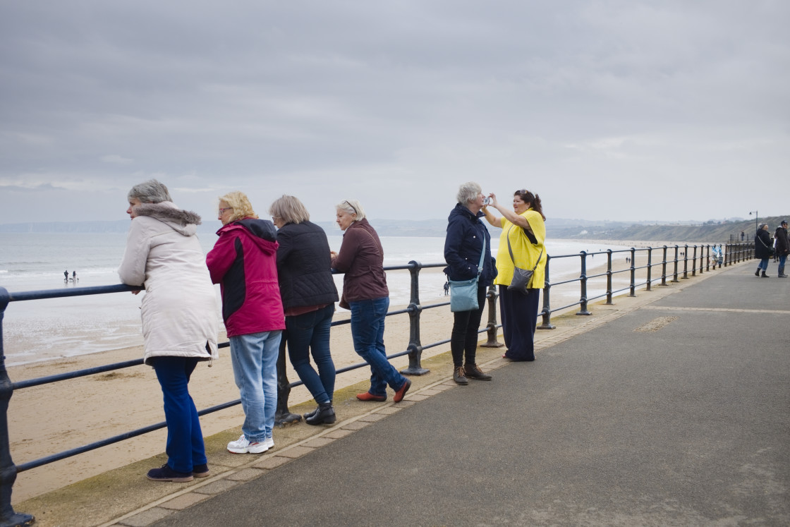 "Watching people at Filey" stock image