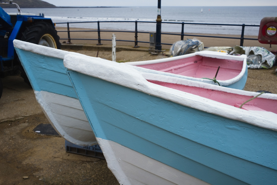 "Pink and blue boats at Filey" stock image