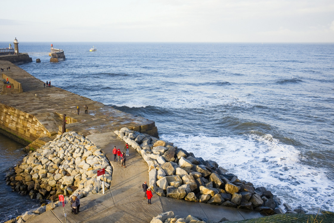 "Looking down onto harbour sea wall at Whitby" stock image