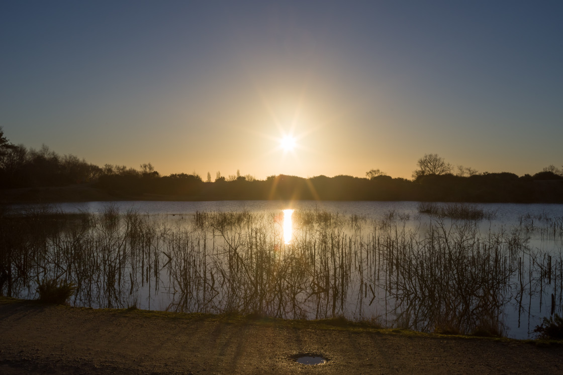 "Sun Rising over Lake" stock image