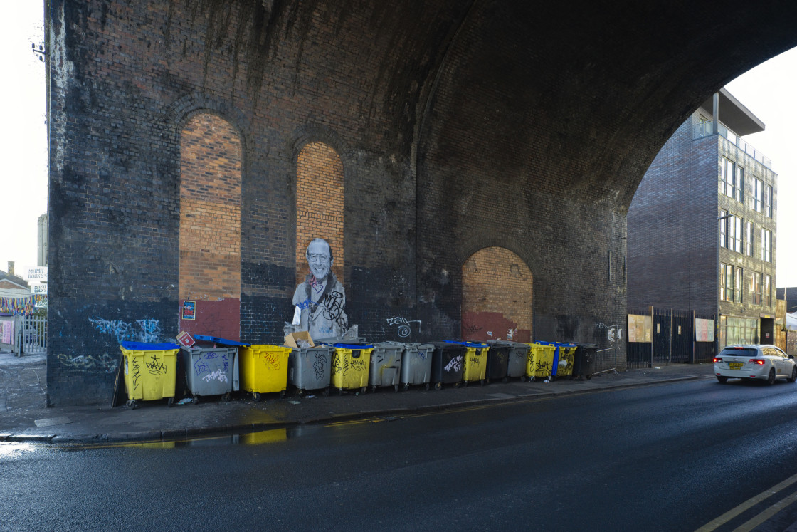 "Waste bins in a line under a railway arch" stock image