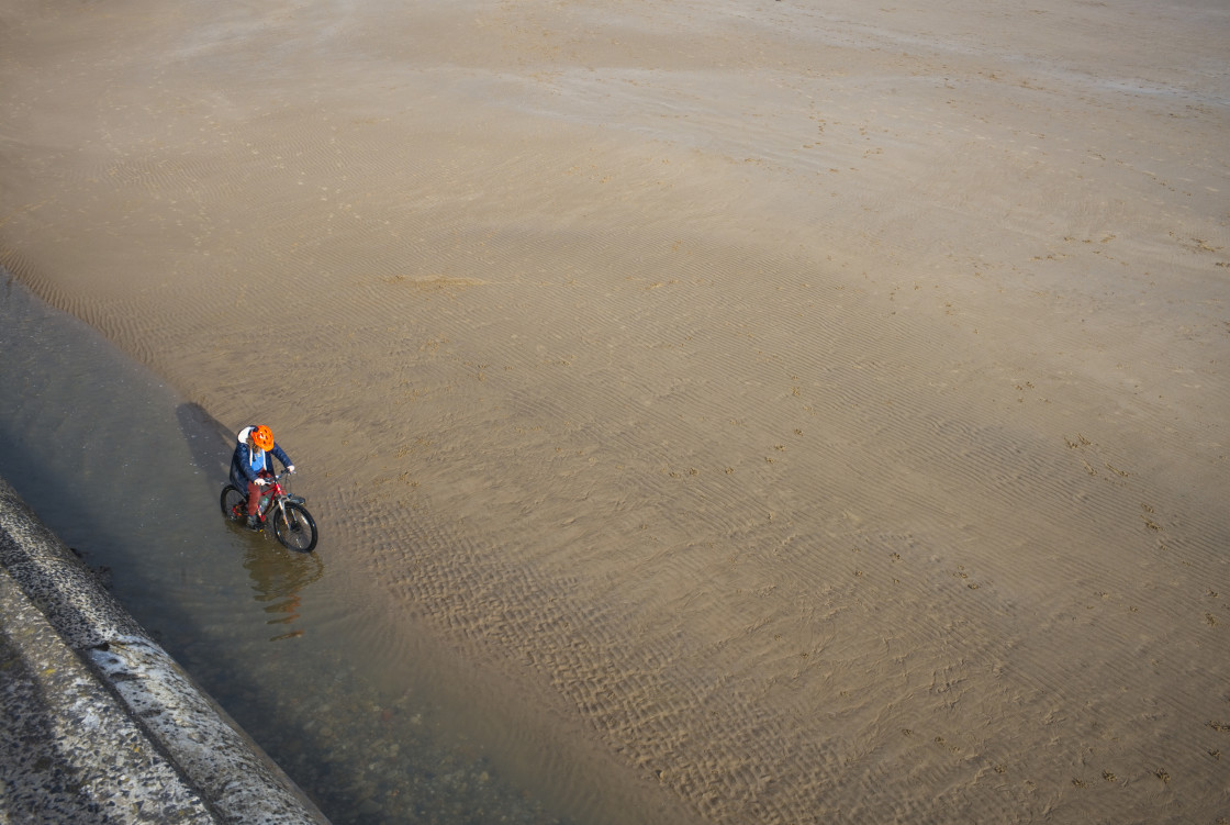 "Looking down on mountain bike rider" stock image