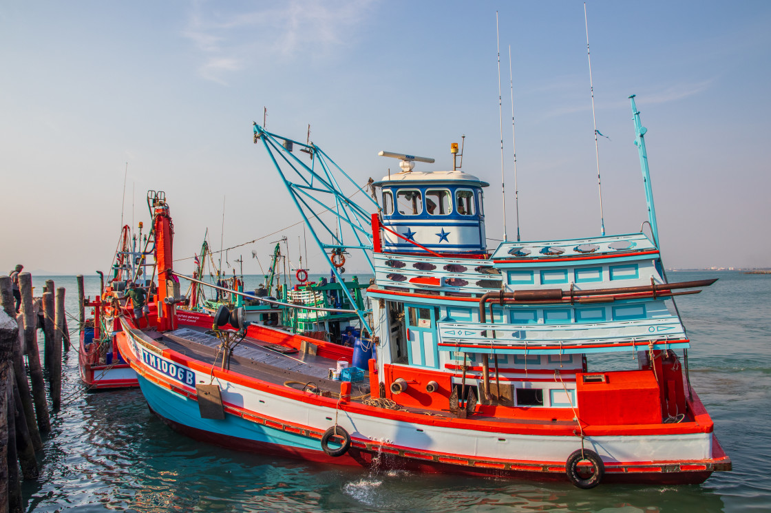 "A fishing boat returns from its tour" stock image